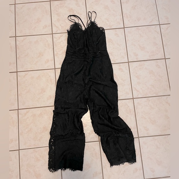 This is a black, pant leg, lacy onesie. Great for a dinner, formal event, etc. - Picture 2 of 4
